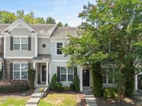 Charming townhome featuring stone accents, tidy landscaping, and a welcoming front entrance at 3100 Berkeley Springs Pl, Raleigh, NC 27616