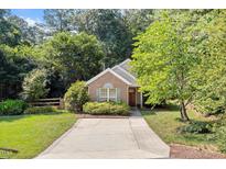 Charming brick home featuring a well-maintained lawn and inviting front entry at 6412 Forest Ridge Dr, Durham, NC 27713