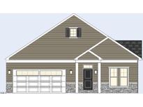 Charming single-story home with stone accents, an integrated garage, and a classic architectural design at 1108 Hudson Dr, Mebane, NC 27302