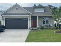 Charming single-story home featuring a cozy front porch and a well-manicured lawn at 3 Meadowrue Ln, Youngsville, NC 27596