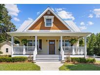 Charming home with inviting front porch, decorative railing, and manicured landscaping offers curb appeal at 4050 Culbreth Rd, Stem, NC 27581