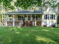 Charming home featuring a large front porch and well-maintained yard at 45 Softwood Dr, Franklinton, NC 27525