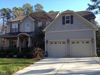 Charming two-story home with stone accents and a two-car garage at 8228 Clarks Branch Dr, Raleigh, NC 27613