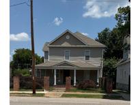Charming two-story home with a covered front porch and a well-maintained yard in a great neighborhood at 903 New Bern Ave, Raleigh, NC 27601