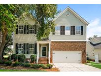 Charming two-story home with a well-maintained yard and a two-car garage at 114 Seastone St, Raleigh, NC 27603