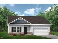 Charming one-story home featuring a covered entryway, attached garage, and well-manicured lawn at 367 Deodora Lane Ln, Cameron, NC 28326