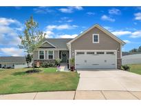 Charming single-Gathering home with a two-car garage and beautifully maintained front yard at 48 Highview Ct, Fuquay Varina, NC 27526