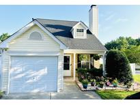 Charming one-story home featuring a well-manicured lawn and attached one car garage at 5849 Ricker Rd, Raleigh, NC 27610