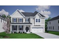 Charming two-story home featuring a covered front porch and a two-car garage in a well-kept neighborhood at 105 Guardian St, Youngsville, NC 27596