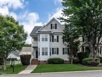 Charming two-story home with a manicured lawn and a classic architectural style at 108 Bally Shannon Way, Apex, NC 27539