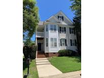 Charming two-story home with traditional architecture and a well-maintained front yard at 108 Bally Shannon Way, Apex, NC 27539