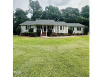 Charming single-story home with a welcoming front porch and well-manicured lawn at 175 Ann Dr, Timberlake, NC 27583