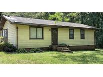 Modest single-story home featuring a simple facade and a compact front yard at 181 Mangums Dr, Wendell, NC 27591