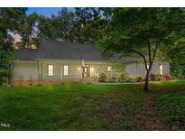 Charming one-story home with a welcoming front porch and well-manicured lawn at 4070 Swannie Coble Rd, Snow Camp, NC 27349