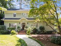 Charming two-story home with landscaped front yard and stone facade detail at 1600 Pineview St, Raleigh, NC 27608