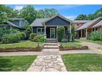 Charming single-story home with stone walkway and inviting curb appeal at 1213 Pierce St, Raleigh, NC 27605