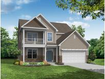 Charming two-story home featuring a covered porch, balcony, and a two-car garage at 1514 Peabody Ct, Mebane, NC 27302