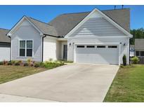 Charming one-story home featuring a two-car garage, a well-maintained lawn, and tasteful landscaping at 2432 Nassau Trce, Fuquay Varina, NC 27526