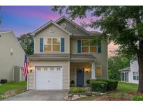 Charming two-story home with a well-maintained lawn and beautiful landscaping at 2810 Catamaunt, Durham, NC 27704