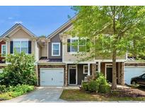 Charming townhome with a one-car garage and welcoming front porch at 449 Christian Creek Pl, Cary, NC 27519