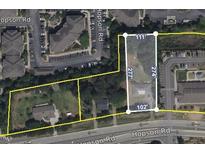 An aerial view shows land and building dimensions on Hopson Road with nearby apartments and parking lots at 4511 Hopson Rd, Morrisville, NC 27560