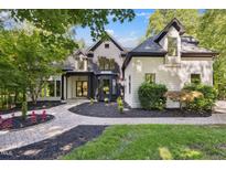 Elegant two-story home featuring a beautifully landscaped front yard and a welcoming brick pathway at 6701 Green Hollow Ct, Wake Forest, NC 27587