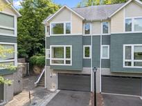 Modern townhome featuring a two-car garage and lots of windows to let in plenty of natural light at 515 Hillsborough St # 111, Chapel Hill, NC 27514