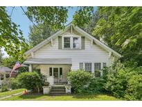Charming home with a front porch, green shutters and landscaping providing nice curb appeal at 711 W Club Blvd, Durham, NC 27701