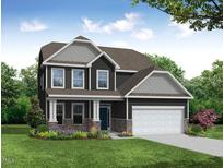 Charming two-story home featuring stone accents, a two-car garage, and a beautifully landscaped front yard at 131 Verona Villa Dr, Burlington, NC 27215