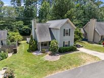 Charming two-story home with landscaped front yard and mature trees in a desirable neighborhood at 519 High Ridge Dr, Durham, NC 27707