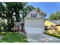 Charming two-story home featuring a well-maintained lawn and a two-car garage at 700 Beddingfield Dr, Knightdale, NC 27545