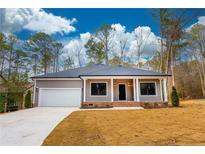 Ranch style home with gray siding, white trim, and a two-car garage at 3011 Bourbon St, Sanford, NC 27332