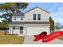 Two-story house with gray siding, a white garage door, and a red move-in ready banner at 23 Alderman (Lot 1) Ct, Dunn, NC 28334