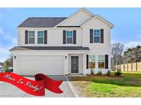 Move-in ready two-story house with a two-car garage and landscaped lawn at 60 Marley (Lot 14) Way, Dunn, NC 28334