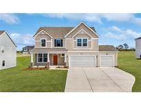 Two-story home with a two-car garage and landscaped lawn at 60 Steeple (Lot 598) Rdg, Cameron, NC 28326