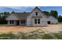 New construction home featuring an unfinished exterior and a sprawling front yard at 375 Graham Rd, Cameron, NC 28326