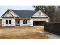 Newly constructed home with attached two-car garage at 137 Nectar Ln, Bunnlevel, NC 28323