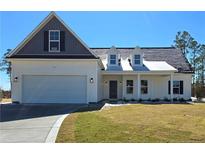 Beautiful single Gathering house with a well-maintained lawn and an attached two car garage at 102 Onslow Ct, Spring Lake, NC 28390