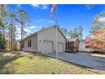 Brick house with two-car garage and landscaping at 51 Cedar Ln, Sanford, NC 27332