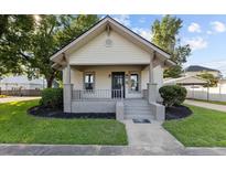 Charming craftsman style home with a welcoming front porch and landscaped lawn at 205 N Layton Ave, Dunn, NC 28334