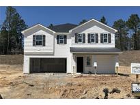 Charming two-story home featuring white siding, black shutters, and an attached two-car garage at 3 Bennington Way, Lillington, NC 27546