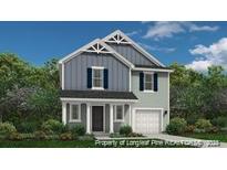 Two-story home with gray siding, white trim, and a two-car garage at 43 Bennington (Lot 557) Way, Lillington, NC 27546