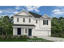 Two-story home with white siding, navy blue accents, and a two-car garage at 57 Bennington Way, Lillington, NC 27546