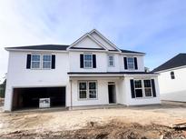 Two-story house with white siding, black windows, and a two-car garage at 67 Steeple Ridge (Lot 466), Cameron, NC 28326