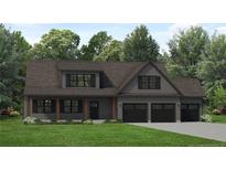 Two-story house with gray siding, three-car garage, and a covered porch at 186 Mahogany Ct, Cameron, NC 28326