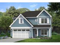 Two-story house with blue siding, white garage door, and landscaping at 39 Tackett Ct, Lillington, NC 27546