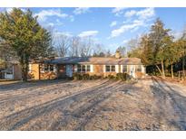 Ranch style home with mature trees and a large yard at 1600 Dogwood Acres Dr, Sanford, NC 27330