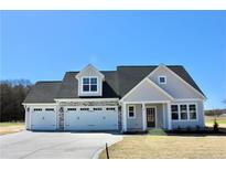 Charming single Gathering home featuring a three-car garage and neutral color palette at 48 Surles Landing Way, Benson, NC 27504