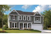 Two-story home with gray siding, white trim, and a two-car garage at 368 Steeple Ridge, Cameron, NC 28326