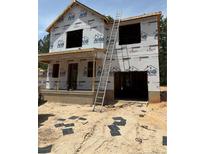 Image shows the exterior of the home during the construction phase; ladder present at 238 Appaloosa - Lot 61 Dr, Spring Lake, NC 28390